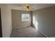 Well-lit bedroom featuring neutral walls, ceiling fan, and a window for natural lighting at 13031 Dexter St, Thornton, CO 80241