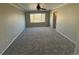 Spacious bedroom featuring neutral walls, plush carpeting, and a ceiling fan for added comfort at 13031 Dexter St, Thornton, CO 80241