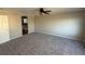 Large bedroom showcasing soft carpeting, a ceiling fan, and lots of natural light at 13031 Dexter St, Thornton, CO 80241