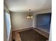 Bright dining room featuring stylish chandelier, and neutral walls with a tile floor design at 13031 Dexter St, Thornton, CO 80241
