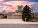 Charming brick home featuring a three-car garage and well-maintained landscaping at 13031 Dexter St, Thornton, CO 80241
