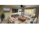 Modern living room featuring stylish furnishings, a large screen TV, and ample seating at 13031 Dexter St, Thornton, CO 80241