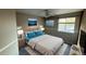Tranquil main bedroom with a king size bed, ceiling fan, and calming wall art at 13031 Dexter St, Thornton, CO 80241