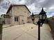 Expansive concrete patio with outdoor lighting, offering a charming and inviting space for gatherings at 13031 Dexter St, Thornton, CO 80241