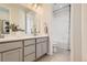 Bathroom featuring double vanity with modern fixtures and a separate toilet and shower area at 13940 Hanging Lake St, Parker, CO 80138