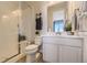 Modern bathroom with a glass-enclosed shower, sleek fixtures, and a clean, contemporary design at 13940 Hanging Lake St, Parker, CO 80138
