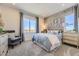 Cozy bedroom with stylish wallpaper accent, plush carpeting, ample natural light, and modern furnishings at 13940 Hanging Lake St, Parker, CO 80138