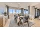 This dining area is brightly lit with natural light and offers stunning views, seating eight with ease at 13940 Hanging Lake St, Parker, CO 80138