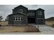Charming two-story home with a two car garage, stone accents, modern design and professionally landscaped front yard at 13940 Hanging Lake St, Parker, CO 80138