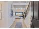 Inviting foyer leads to a bright, open living area with high ceilings and large windows showcasing scenic views at 13940 Hanging Lake St, Parker, CO 80138