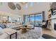 Spacious living room featuring a large sliding glass door, comfortable seating, and stylish decor at 13940 Hanging Lake St, Parker, CO 80138