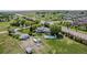 Expansive property boasts a pool, outbuildings, and fenced yard with lush greenery at 14447 Madison St, Thornton, CO 80602