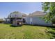 A charming two-story home with a lush green lawn and wooden deck under a clear blue sky at 14447 Madison St, Thornton, CO 80602