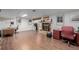 Large basement space with fireplace, wood floors, and potential office area at 14447 Madison St, Thornton, CO 80602