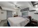 Bedroom featuring a neutral color scheme, ample closet space, and ceiling fan at 14447 Madison St, Thornton, CO 80602