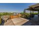 Outdoor deck with a built-in grill, seating, and scenic surroundings at 14447 Madison St, Thornton, CO 80602