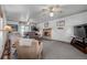 Spacious living room with a brick fireplace, carpeted floors, and ample seating at 14447 Madison St, Thornton, CO 80602
