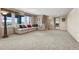 A large open carpeted basement space, perfect for entertaining or relaxing at 5192 Sedona Dr, Parker, CO 80134