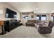 Basement room with a TV and a large comfortable lounging sofa at 5192 Sedona Dr, Parker, CO 80134