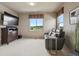 Cozy media room with comfortable seating, big screen TV, and a nice view at 5192 Sedona Dr, Parker, CO 80134