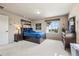 Cozy bedroom featuring a bed with storage drawers and view of the neighborhood at 5192 Sedona Dr, Parker, CO 80134