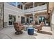 Charming courtyard with stone accents, comfortable seating, and an inviting stone fire pit for outdoor gatherings at 5192 Sedona Dr, Parker, CO 80134