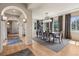 Spacious dining room with hardwood floors, a modern chandelier, and large windows at 5192 Sedona Dr, Parker, CO 80134