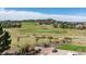 Green golf course view from the backyard with a seating area at 5192 Sedona Dr, Parker, CO 80134