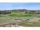 Picturesque golf course view from backyard with patio seating at 5192 Sedona Dr, Parker, CO 80134