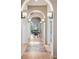 Beautiful hallway with archways leading to an outside sitting area with a view at 5192 Sedona Dr, Parker, CO 80134