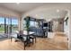 Bright, open concept dining and living room area with big windows and hardwood floors at 5192 Sedona Dr, Parker, CO 80134