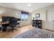 Home office with a modern desk setup and a view of the mountains at 5192 Sedona Dr, Parker, CO 80134