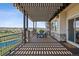 Covered back patio with a table and seating overlooking the pool at 5192 Sedona Dr, Parker, CO 80134