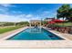 Beautiful pool with lounge chairs and umbrellas, offering a serene and inviting outdoor entertainment area with scenic views at 5192 Sedona Dr, Parker, CO 80134