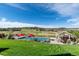 Gorgeous pool area overlooking the golf course, complete with a covered patio and ample space for outdoor entertaining at 5192 Sedona Dr, Parker, CO 80134