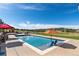 Refreshing pool with a basketball hoop and chairs provides a fun and relaxing outdoor space with scenic views at 5192 Sedona Dr, Parker, CO 80134