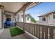 Covered porch with stone accents, a blue rocking chair, and views of the surrounding neighborhood at 5192 Sedona Dr, Parker, CO 80134