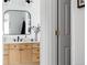 Bathroom featuring stylish mirror and light wood vanity at 4500 E Louisiana Ave, Denver, CO 80246