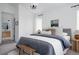Bright bedroom with en-suite bathroom access showcasing neutral décor and a stylish aesthetic at 4500 E Louisiana Ave, Denver, CO 80246
