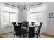 Bright dining area with hardwood floors, large windows, and a stylish chandelier at 4500 E Louisiana Ave, Denver, CO 80246