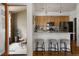 Cozy kitchen with modern appliances, counter seating, and access to an outdoor patio at 4500 E Louisiana Ave, Denver, CO 80246