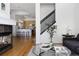 Inviting living room featuring a fireplace and seamless flow into the modern kitchen area at 4500 E Louisiana Ave, Denver, CO 80246