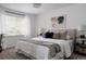 Serene main bedroom with neutral tones, ample natural light, and stylish decor at 4500 E Louisiana Ave, Denver, CO 80246