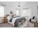 Bright main bedroom featuring a vaulted ceiling, neutral decor, and lots of natural light at 4500 E Louisiana Ave, Denver, CO 80246