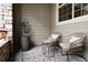 Relaxing outdoor seating area with comfortable wicker furniture and a modern patterned rug at 4500 E Louisiana Ave, Denver, CO 80246