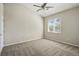 Neutral bedroom with ceiling fan, window, and plush carpeting at 9557 W San Juan Cir # 306, Littleton, CO 80128