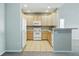 The kitchen is equipped with bright cabinets and appliances, offering a functional layout at 9557 W San Juan Cir # 306, Littleton, CO 80128