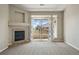 Living room features a fireplace and a sliding glass door to balcony access with nice outdoor views at 9557 W San Juan Cir # 306, Littleton, CO 80128