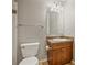 Compact bathroom with a vanity, mirror, lighting, and a tile countertop at 1057 W Century Dr # 112, Louisville, CO 80027