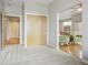 Hallway featuring a coat closet, carpet, wood flooring and access to different rooms at 1057 W Century Dr # 112, Louisville, CO 80027